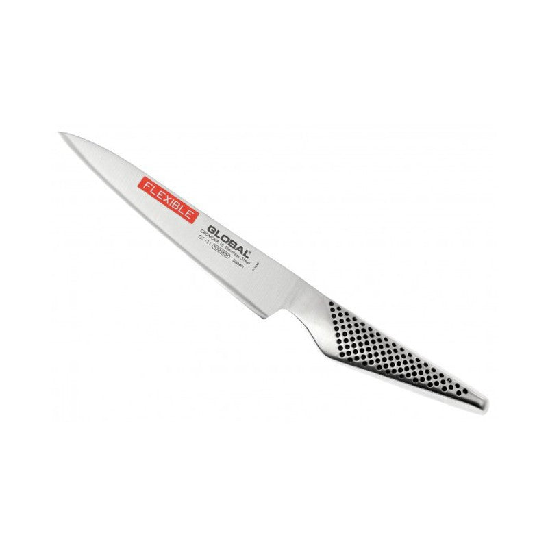 Cuchillo Global GS-11 utilitario flexible sobre superficie de madera, perfil de hoja